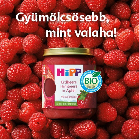 Egy üveg málnalekvár biocímkével, körülötte málna.